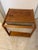 18.25” w x 17 d x 20” high This item is a vintage Danish Modern Teak Magazine Rack and Rolling Side Table. Produced during...