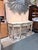 An elegant Louis XVI style demi lune console table showcasing refined neoclassical design and exceptional decorative...
