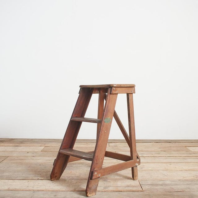 A charming set of original wooden step ladders manufactured by hendrik a. Van waveren ladderfabriek (ladder factory) an...