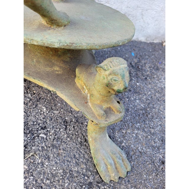 Thymiaterion, or incense burner, in patinated bronze, decorated with a central character, probably a dancer, standing on a...