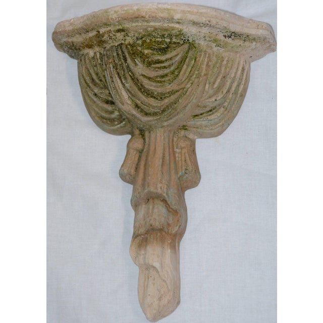 We are offering a lovely pair of terracotta wall sconce with nice draping in the design. The aged patina gives them a...