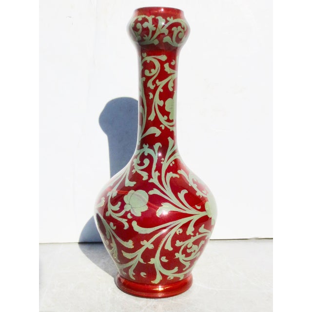 English Art glass vase. A garlic-headed vase with a Chinoiserie enameled pattern over the whole surface. Opaque red/brown...
