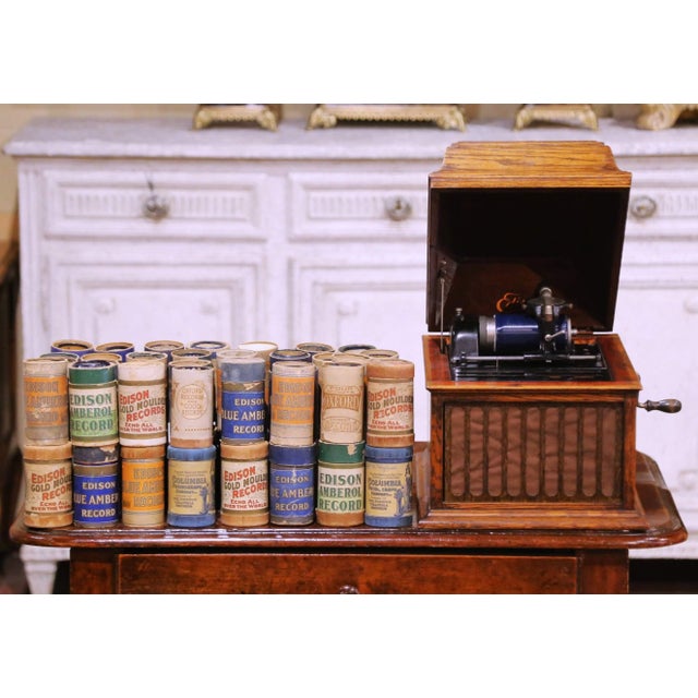Bring the sound of early recorded music into your home with this antique Edison cylinder phonograph, crafted in the United...