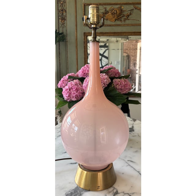 Lovely pastel lamp in blush pink with an elegant elongated neck and bulbous teardrop silhouette that rises from a brushed...