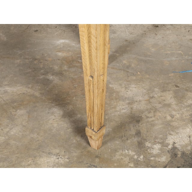 An Italian Neoclassical bleached oak console table from the 19th century, with red marble top, fluted legs and arrow feet....