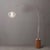 The Tambo Arc Floor Lamp is a dimmable lighting solution with a satin nickel body and a sphere white satin steel shade,...
