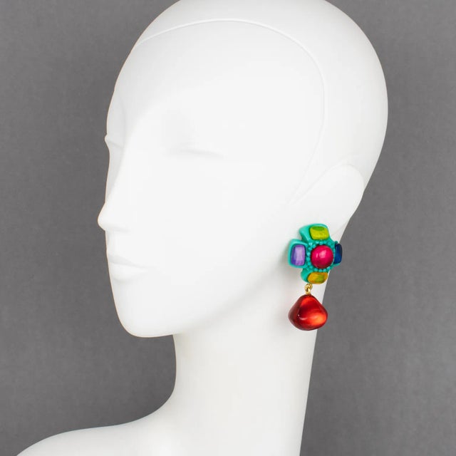 Dominique Denaive Paris designed these gorgeous dangling clip-on earrings. They feature a carved cross shape embellished...