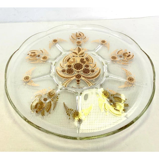 Pretty gold overlay glass round dish from the 1960's marked George Briard. Overlay glass was developed by German artisan...