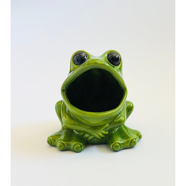 A mid century ceramic frog bowl. Adorable stylized details. Finished in a vibrant green glaze. Perfect for keeping small...