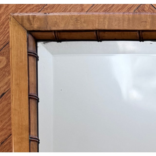 A charming late 19th century faux bamboo mirror framed in birdseye maple and displaying all the hallmarks of the American...