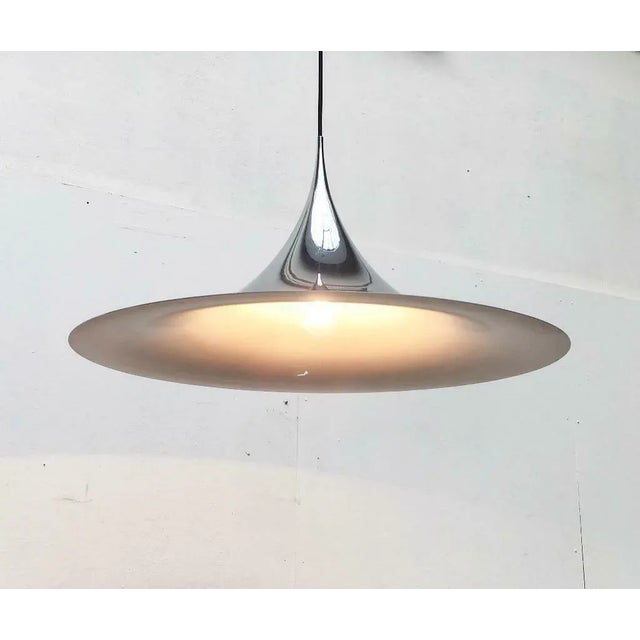 Great semi pendant light from the Danish manufacturer Fog & Mørup in the rare, chrome-colored version. Elegant shape,...