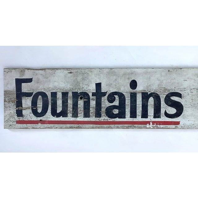 Vintage hand lettered on wood board farm store sign for Fountains Feeders, sign is one sided. Sign has wear from use,...