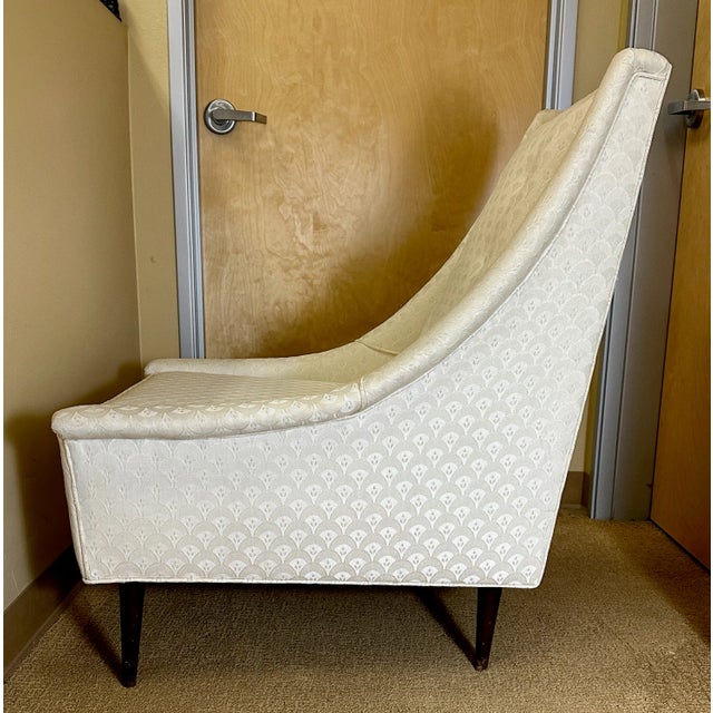 Mid century high back arm chair. Unsigned, could be Selig; identified as Selig Style. Age is estimated to be c. 1975.The...