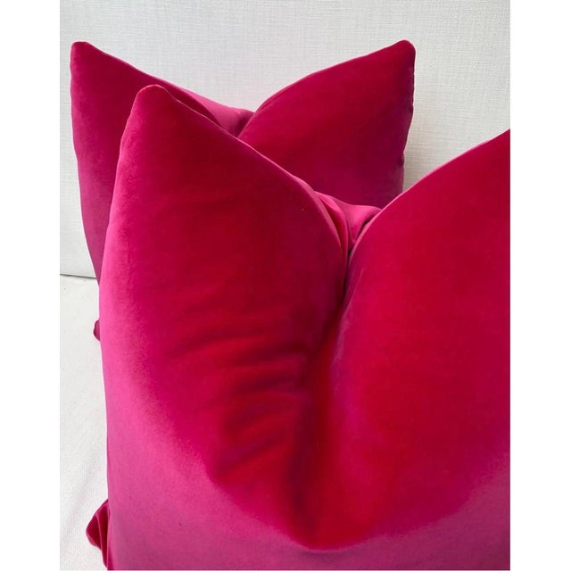Custom pair of 22" pillows covered in a luxe cotton velvet in a bright hot pink color. These pillows have tapered corners...