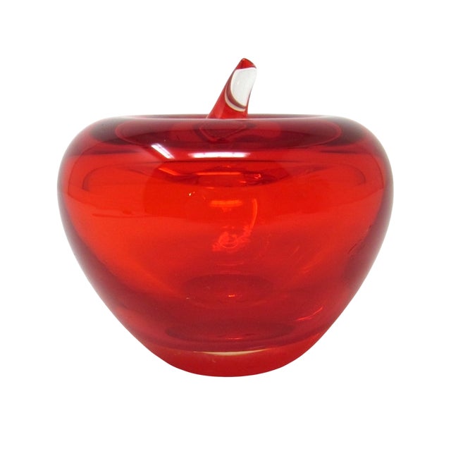 A candy apple red glass apple paperweight. Made of translucent hand blown glass, this piece has a rich glossy finish and a...