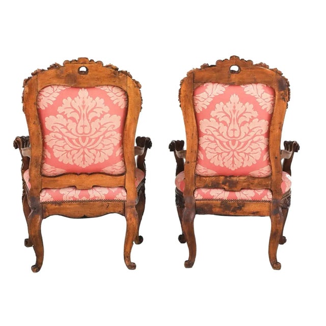 Late 19th century large pair of Italian Armchairs. Each exuberantly carved example with a padded back surmounted by a...