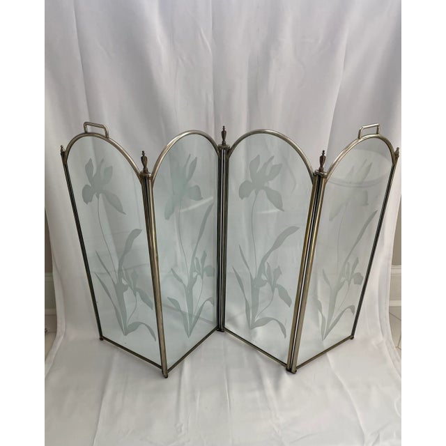 Four arched glass panels with etched frosted Irises adorning the front. Able to accommodate most fireplaces as it expands...