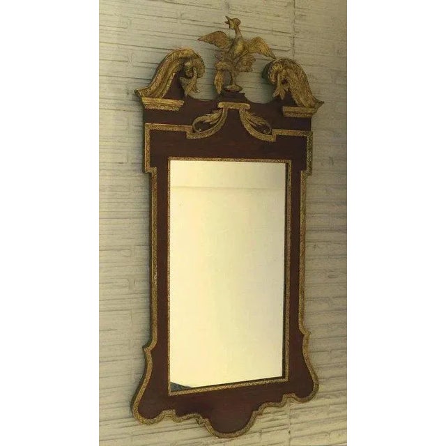 Wonderful Gorge III style gilt and mahogany mirror. Carved Ho Ho Phoenix bird. Arched pediment top. Measures 24" by 49"...