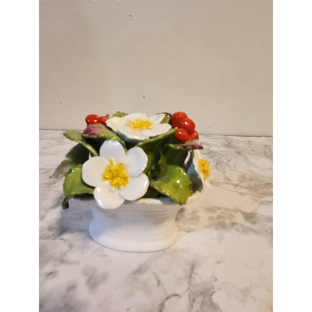 This is a beautiful bouquet of fine bone china. It is hand painted and produce by Aynsley in England