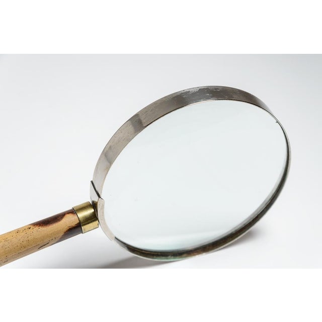Just in this large and very unusual Antique Silver & Bamboo Desk Magnifying Glass With Long Figural Handle. The tip of the...