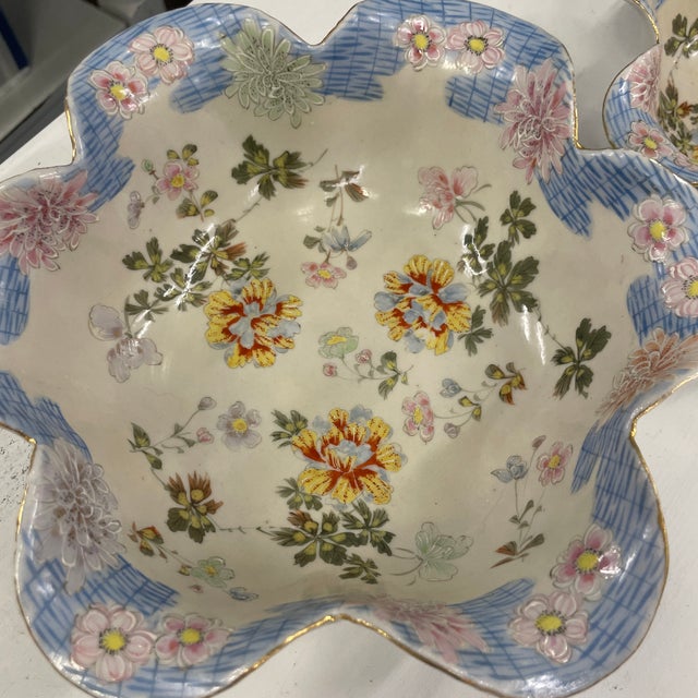Stunning pair of hand decorated Japanese nesting bowls with a unique scalloped edge design. I believe these to be Kutani...