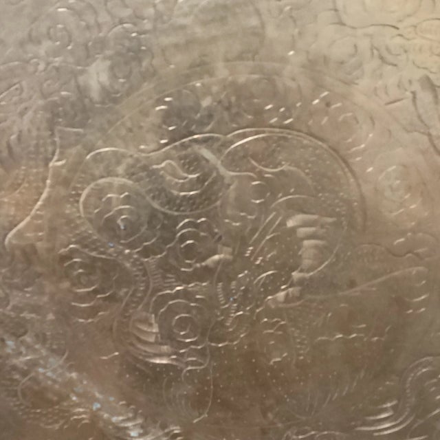 Antique highly crafted, engraved, and detailed Chinese tray. Constructed of solid brass with engraved with Asian design.