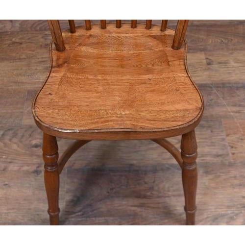 Attractive country style Windsor side chair with warm honey coloured timber. The tall bowed back frames a series of...