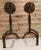 Pair of impressive andirons with large elaborately cast and hand hammered pierced brass rose heads mounted on shaped steel...