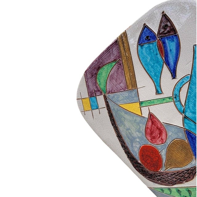 Vintage Italian ceramic wall plaque by Raymor features a striking mid-century modern still life composition. Hand-painted...