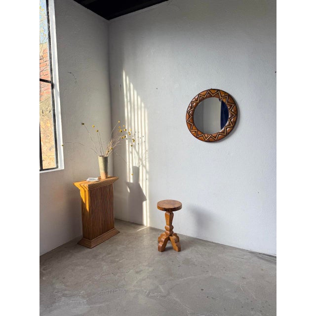 Antique stool in solid elm, entirely handcrafted, inspired by folk art. The round seat is carved from a single piece of...