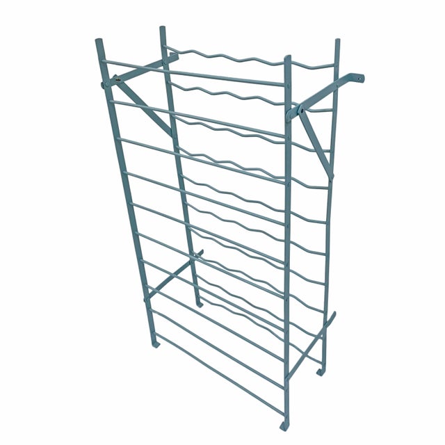 Charming French vintage metal wine rack painted green. Designed with five vertical columns and ten horizontal rows, it...