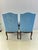 Carved wooden headboard chair with floral decoration. It has blue upholstery. Both the upholstery and the wood are in...