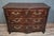 A louis xv/18th-century lyonnaise commode in molded and carved walnut, opening at the front with three wide drawers. it...