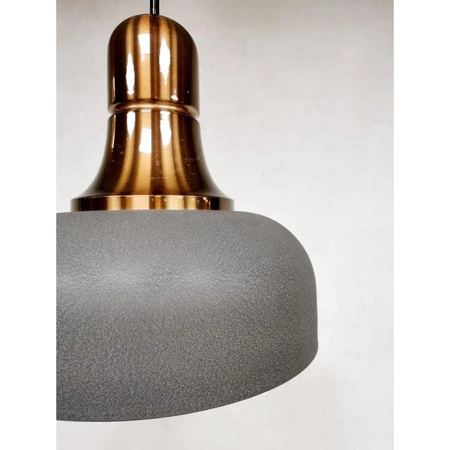 Beautiful Dutch design! A unique vintage design hanging lamp of touch with a beautiful design with copper color accent....