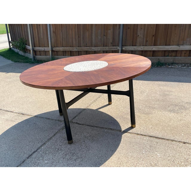 Designed by Harvey Probber which could be used as a coffee table or gaming table. Walnut top with a terrazzo insert and an...
