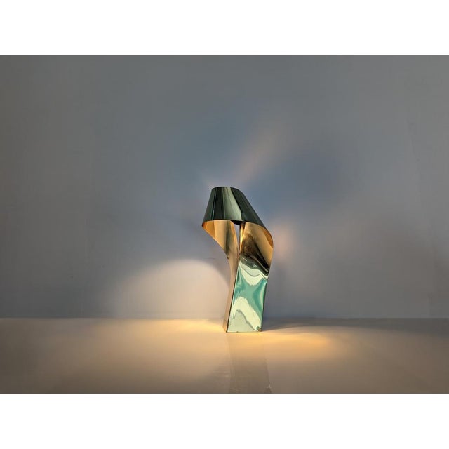 Spectacular design lamp created in the 60s/70 made of brass with clean and elegant lines that show the character and...