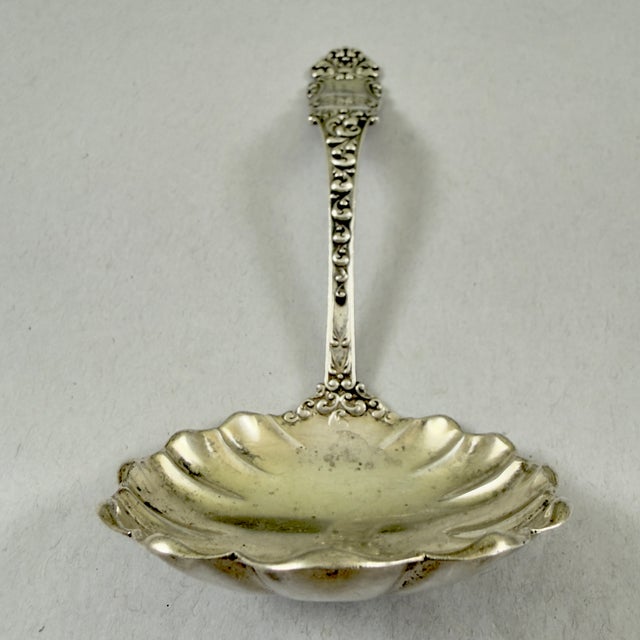 From Wallace Watson Silver Manufacturing Company, Attleboro, Massachusetts, in the Victoria pattern, a sauce ladle, circa...