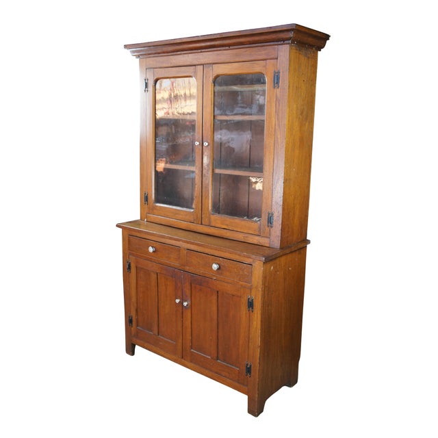 Primitive Antique Late 19th Century Stepback Cabinet. Made from oak with a glass double door Hutch opening to three...