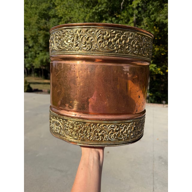 Beautiful antique copper and repoussé brass decorative wastepaper basket, dating approximately to the late 19th/early 20th...