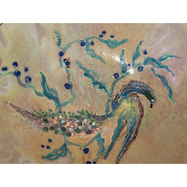 Delve into the exquisite craftsmanship of this rare antique Chinese enamel brass dish, a testament to the intricate...