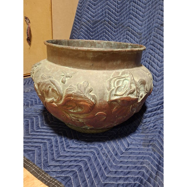 An impressive antique Art Nouveau copper jardinère featuring deeply repoussé decoration of naturalistic motifs that...