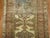 an early 20th century neutral tone Persian Malayer Wide Runner. some animals spotted in the field