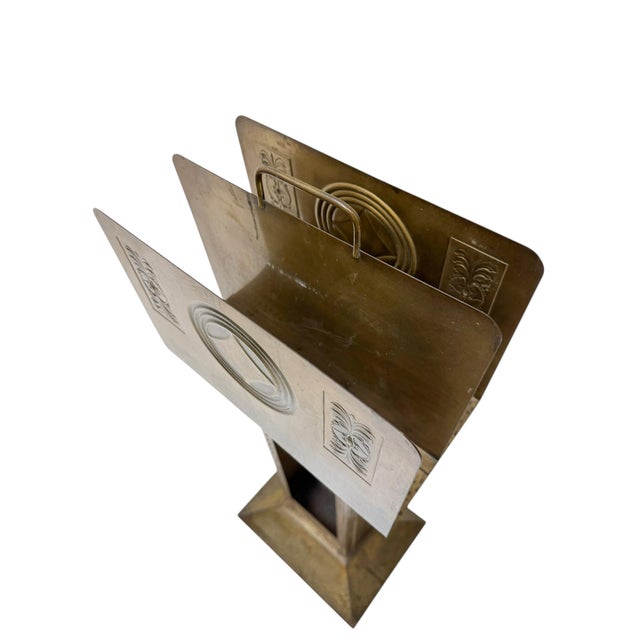 Stunning and rare Vienna Secession magazine rack. Striking Austrian design from the 1900s. Patinated brass frame with...