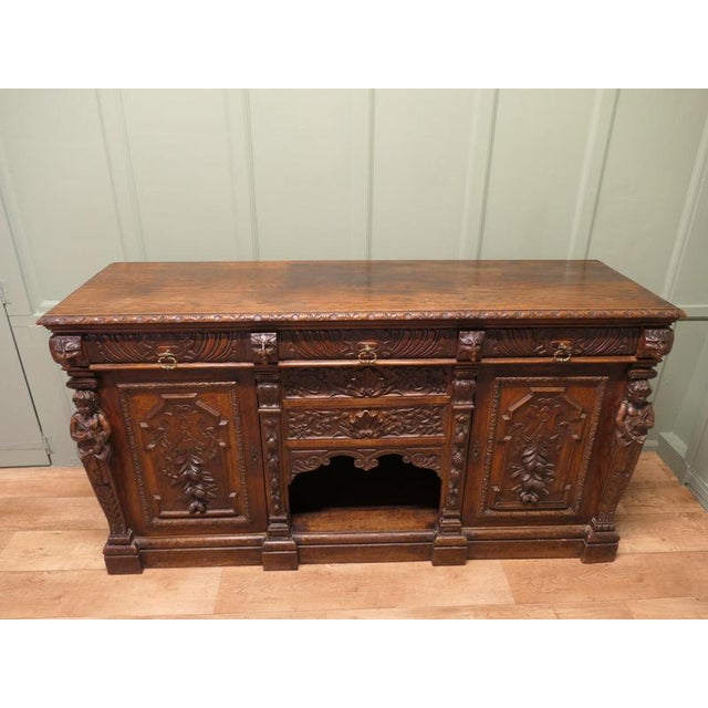 This is an excellently carved piece, carvings of the Green Man, Lions Masks, Mythical Caryatid and the fruits of the sea,...