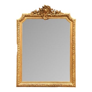 19th Century French Louis XV Giltwood Wall Mirror With Floral Crest For Sale