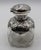 London, 1898, sterling and blown glass scent bottle. Pinched form. The silver decorated with large cartouches of little...