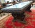 Large Italian carved walnut dining / centre table with a generous carved freeze all around bases fronted by carved figures...