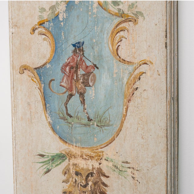 A magnificent pair of vertical wooden panels, originally conceived as part of a boiserie (wood paneling for walls). They...