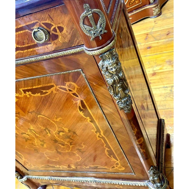 Make a statement with this grand French Louis XVI-inspired commode, featuring a richly finished wood exterior with...