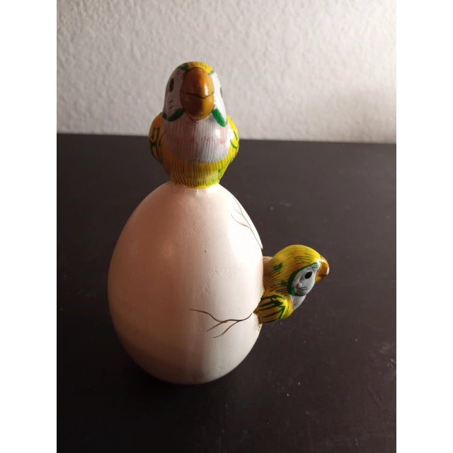 This is handmade Mexico Ceramic Egg with Hatching Toucans Sculpture. Procured at auction Other similar pieces sold...